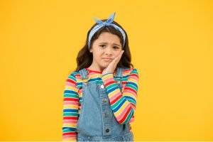 little girl with a toothache
