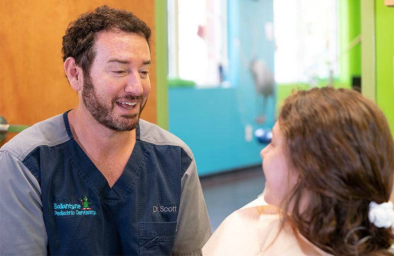 Dr.Scott with a client in the Ballantyne Office.