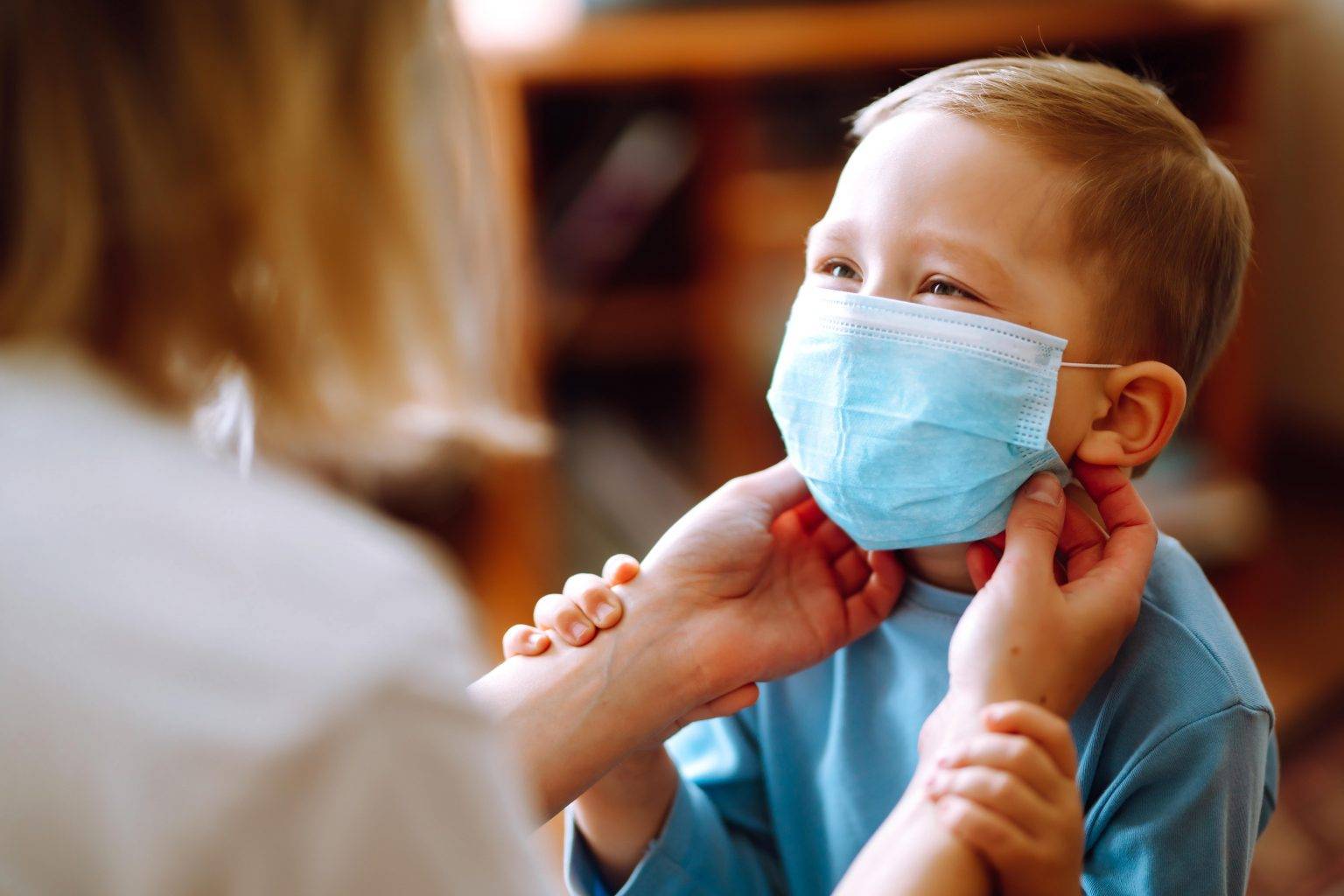 little boy wearing mask